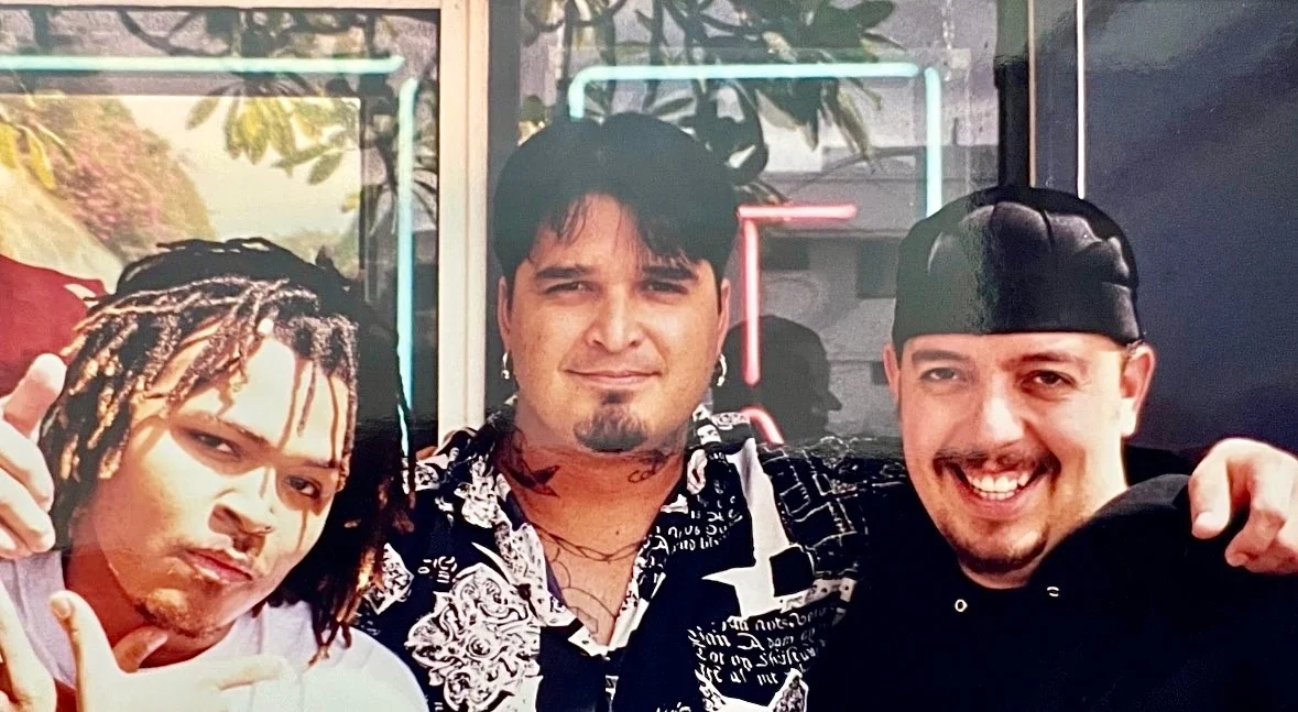 Members of the Black Eyed Peas with Kevin Mokuahi at Steel Bamboo Tattoo in downtown Waikiki after a session