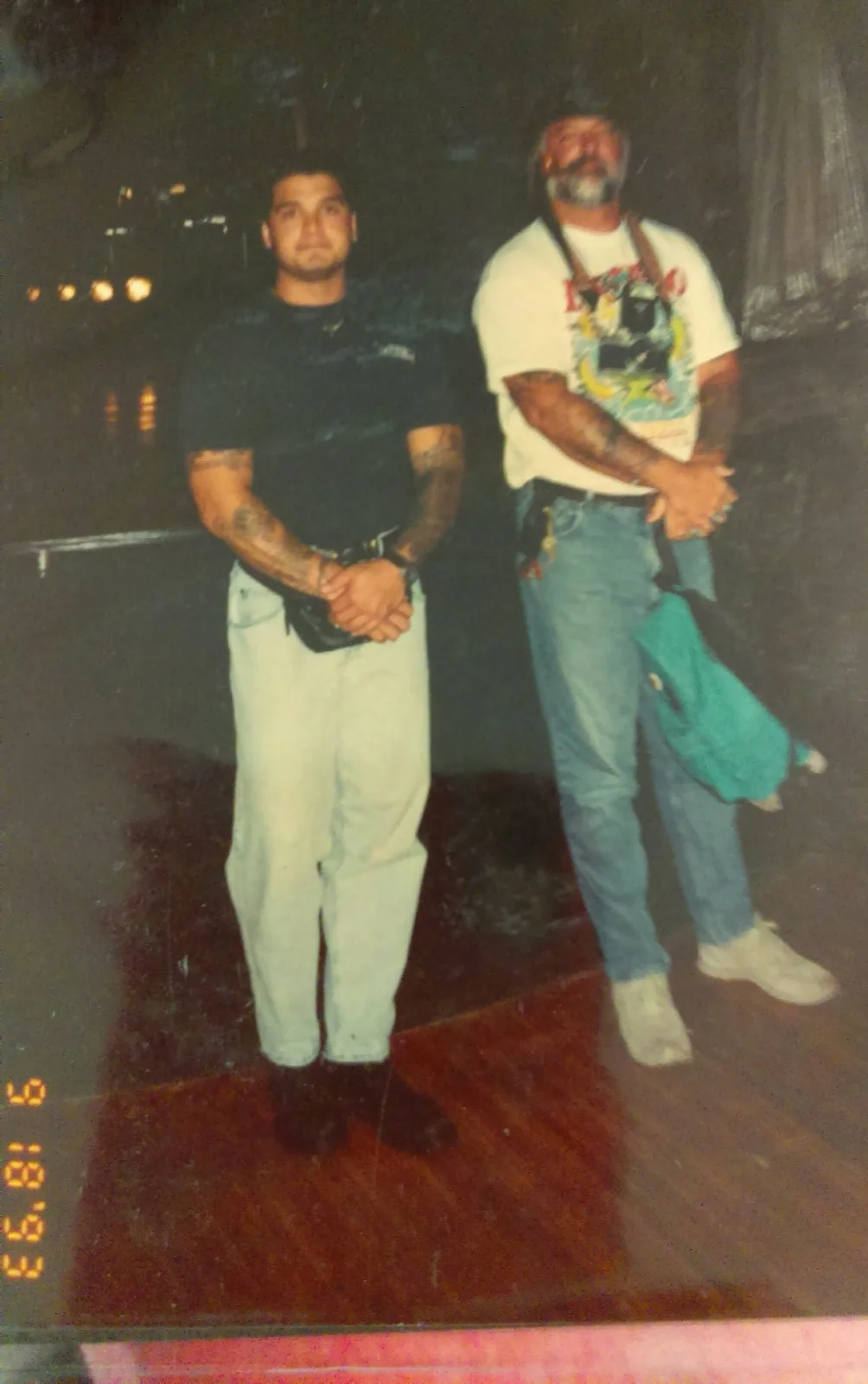 Young Kevin Mokuahi standing with his tattoo mentor, dated 9/13/93